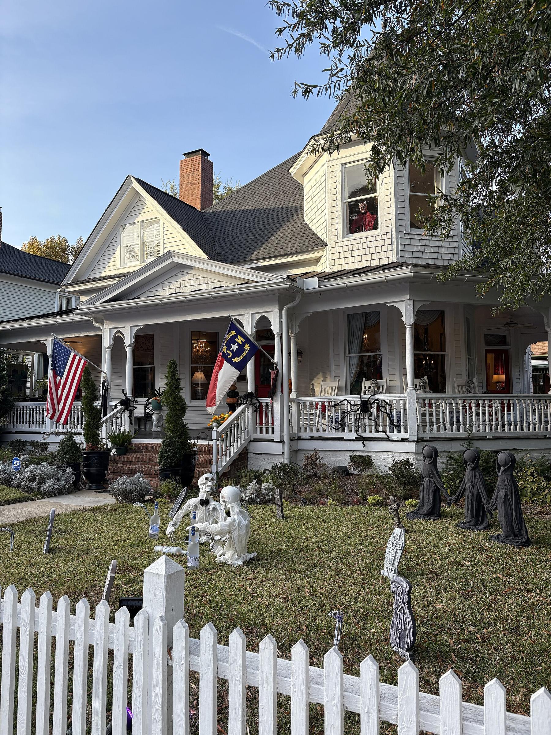 Victorian home with white picket fence in historic Raleigh